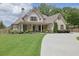 Charming home featuring well-manicured lawn and a welcoming front porch at 2205 Beaver Shop Ne Rd, Marietta, GA 30066