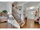 Beautiful foyer with hardwood floors, decorative staircase and front door with sidelights at 2205 Beaver Shop Ne Rd, Marietta, GA 30066