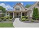Inviting covered front porch with elegant columns and manicured greenery at 2205 Beaver Shop Ne Rd, Marietta, GA 30066