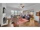 Cozy living room featuring a fireplace, hardwood floors, and large windows at 2205 Beaver Shop Ne Rd, Marietta, GA 30066