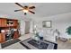 Bright living room features a ceiling fan, a desk, a comfortable couch and a glass table at 2205 Beaver Shop Ne Rd, Marietta, GA 30066