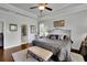 Comfortable main bedroom suite with tray ceiling, hardwood floors, and an en-suite bathroom at 2205 Beaver Shop Ne Rd, Marietta, GA 30066