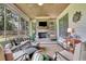 Cozy sunroom with a fireplace and plenty of natural light, perfect for relaxation and entertaining at 2205 Beaver Shop Ne Rd, Marietta, GA 30066