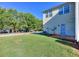Large, grassy backyard, mature trees, and a neighborly view at 2326 Nicole Dr, Hampton, GA 30228
