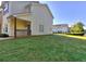 Exterior view showcasing a well-manicured lawn and a cozy porch area at 2326 Nicole Dr, Hampton, GA 30228