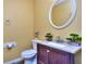 Cozy bathroom with decorative oval mirror, granite countertop, and stylish fixtures at 2326 Nicole Dr, Hampton, GA 30228