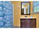 Bathroom featuring a dark vanity and a shower/tub combo with a seashell shower curtain at 2326 Nicole Dr, Hampton, GA 30228