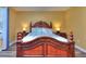 This bedroom features a decorative wood bed frame with matching side tables and a yellow painted wall at 2326 Nicole Dr, Hampton, GA 30228