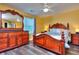 Elegant bedroom with ornate furniture set, including bed and dresser, complemented by natural light at 2326 Nicole Dr, Hampton, GA 30228