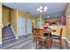 Inviting dining area with a view into the kitchen, and staircase at 2326 Nicole Dr, Hampton, GA 30228
