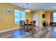 Inviting dining space boasts a round table with seating for four, bathed in natural light from a large window at 2326 Nicole Dr, Hampton, GA 30228