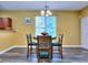 Bright dining nook featuring a round table with chairs, and natural light, perfect for everyday meals at 2326 Nicole Dr, Hampton, GA 30228