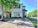 Charming two-story townhome with a well-maintained front yard and ample parking space at 2326 Nicole Dr, Hampton, GA 30228