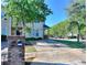 Inviting townhome with mature trees, a long driveway, and a brick mailbox structure at 2326 Nicole Dr, Hampton, GA 30228