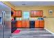 Efficient kitchen with stainless steel fridge, dark cabinets, and open layout for easy cooking at 2326 Nicole Dr, Hampton, GA 30228