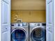 Modern laundry closet features front-load washer and dryer for convenient chores at 2326 Nicole Dr, Hampton, GA 30228