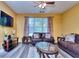 Comfortable living room with leather couches, area rug, and a mounted TV at 2326 Nicole Dr, Hampton, GA 30228