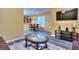 Open-concept living area with stylish furniture, wood-look floors and natural light at 2326 Nicole Dr, Hampton, GA 30228