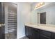 Bathroom with a shower, toilet, sink, mirror, vanity, and cabinets at 430 Pilgrim Ln, Powder Springs, GA 30127