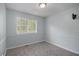 Bedroom features neutral gray walls and plush carpet at 430 Pilgrim Ln, Powder Springs, GA 30127