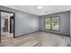 Bright bedroom with windows and neutral gray walls at 430 Pilgrim Ln, Powder Springs, GA 30127