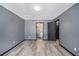 This bedroom has wood-look flooring and access to both the bathroom and closet at 430 Pilgrim Ln, Powder Springs, GA 30127