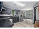 Modern kitchen features stainless steel appliances, gray cabinetry, and bright, natural lighting at 430 Pilgrim Ln, Powder Springs, GA 30127