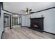 Spacious living room featuring a classic fireplace, hardwood floors, and an open layout at 430 Pilgrim Ln, Powder Springs, GA 30127
