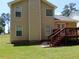 Exterior view of the home with a wooden deck and fenced backyard at 5517 Rock Shoals Way, Atlanta, GA 30349