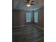 Bedroom with tray ceiling, ceiling fan, wood-look flooring, and natural light at 5517 Rock Shoals Way, Atlanta, GA 30349