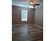Neutral bedroom with updated flooring, ceiling fan, and window at 5517 Rock Shoals Way, Atlanta, GA 30349