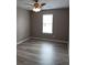 Neutral bedroom with updated flooring, ceiling fan, and window at 5517 Rock Shoals Way, Atlanta, GA 30349