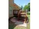 Exterior angle of deck and stairs leading to the yard and a small walkway area at 5517 Rock Shoals Way, Atlanta, GA 30349