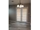 Charming dining area featuring modern light fixture and glass doors leading to the outdoor space at 5517 Rock Shoals Way, Atlanta, GA 30349