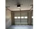 Spacious two-car garage featuring white doors with windows and a clean, well-maintained interior at 5517 Rock Shoals Way, Atlanta, GA 30349