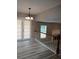 Open living room with wood-look floors and door to the patio at 5517 Rock Shoals Way, Atlanta, GA 30349