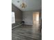Bright living room with gray walls, light wood floors, and natural light at 5517 Rock Shoals Way, Atlanta, GA 30349