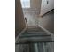 View looking down on wood-look flooring on the stairs and landing at 5517 Rock Shoals Way, Atlanta, GA 30349