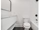 Modern bathroom with white vanity, sleek fixtures, and a bathtub shower combination at 73 Whitefoord Se Ave, Atlanta, GA 30317