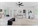 Spacious bedroom boasts neutral decor, a ceiling fan, and an ensuite bathroom for a luxurious and relaxing retreat at 73 Whitefoord Se Ave, Atlanta, GA 30317