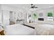 Bright bedroom featuring carpet flooring, a fireplace, and an ensuite bathroom for a relaxing retreat at 73 Whitefoord Se Ave, Atlanta, GA 30317