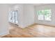 Sunlit room with hardwood floors and glass paneled doors with beautiful backyard view at 73 Whitefoord Se Ave, Atlanta, GA 30317