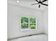 Bright bedroom with a large window that offers a scenic view and a modern ceiling fan at 73 Whitefoord Se Ave, Atlanta, GA 30317