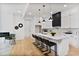 Modern kitchen featuring a marble counter, black hardware, and stainless steel appliances at 73 Whitefoord Se Ave, Atlanta, GA 30317