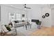 Bright living room featuring hardwood floors, a modern fireplace, and stylish furnishings at 73 Whitefoord Se Ave, Atlanta, GA 30317