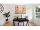 Cozy office space with natural light, featuring a desk, artwork, and hardwood floors at 73 Whitefoord Se Ave, Atlanta, GA 30317