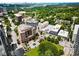 Aerial view of the property and surrounding neighborhood featuring trees and buildings at 1421 Peachtree Ne St # 203, Atlanta, GA 30309