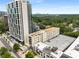 Stunning aerial view showcasing the building's architecture, landscaping, and location with city views at 1421 Peachtree Ne St # 203, Atlanta, GA 30309