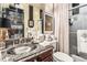Bathroom featuring granite countertop vanity and shower behind white curtains at 1421 Peachtree Ne St # 203, Atlanta, GA 30309