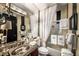 Elegant bathroom featuring granite countertop sink, coordinated towels, and tiled shower for a spa-like experience at 1421 Peachtree Ne St # 203, Atlanta, GA 30309
